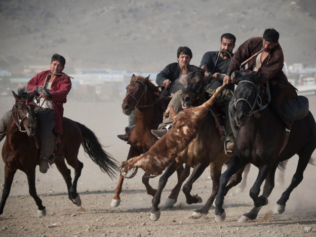 In the Afghani sport buzkashi, players on horseback try to toss a decapitated goat carcass into the 'circle of justice.'