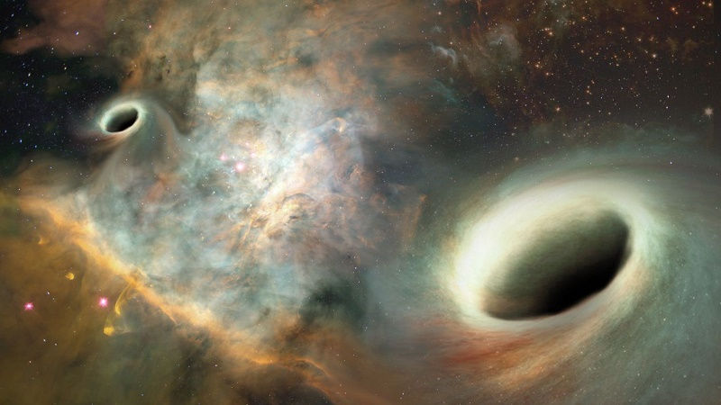 Orbiting Supermassive Black Holes Discovered for First Time