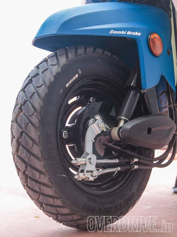 The Honda Cliq will be shod with chunky block-treaded tubeless tyres. We saw MRF Mogrip and Ceat Gripp tyres on the launch scooters. Size is 90/100-10. The rims are steel and there is no disc brake option