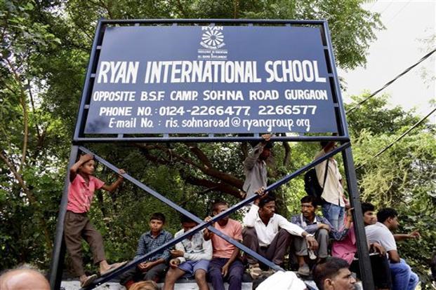 Demonstrators protest outside Ryan International School in Gurgaon as they demand action against the school. File photo: PTI